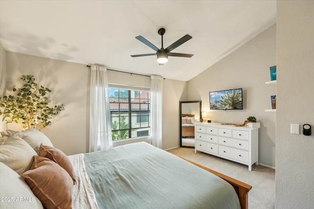 bedroom with baseboards, lofted ceiling, light colored carpet, and a ceiling fan