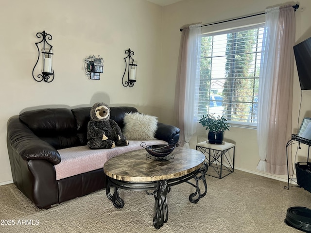 carpeted living room with baseboards