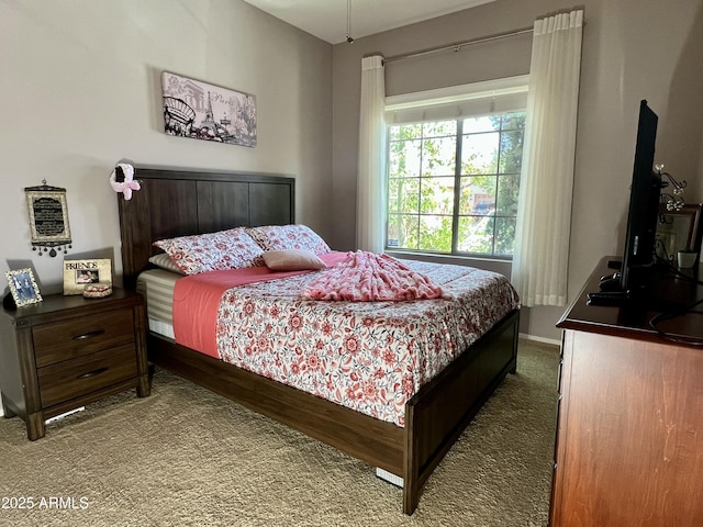 carpeted bedroom with baseboards
