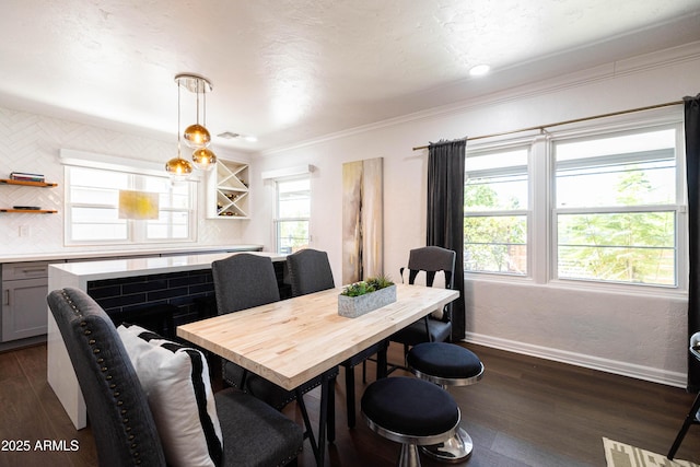546 W Cambridge Ave, Phoenix, AZ 85003 - dining space featuring dark wood-style floors, baseboards, and ornamental molding