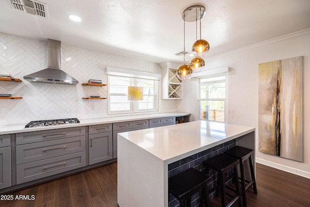 546 W Cambridge Ave, Phoenix, AZ 85003 - kitchen featuring gray cabinets, open shelves, wall chimney exhaust hood, stainless steel gas stovetop, and ornamental molding