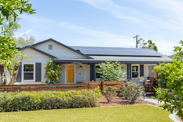 546 W Cambridge Ave, Phoenix, AZ 85003 - single story home featuring a porch, solar panels, and a front yard