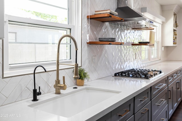 546 W Cambridge Ave, Phoenix, AZ 85003 - kitchen with a sink, stainless steel gas stovetop, backsplash, light countertops, and open shelves