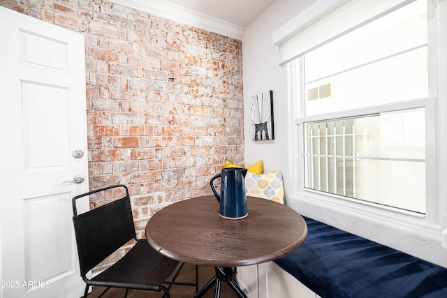 546 W Cambridge Ave, Phoenix, AZ 85003 - dining room with brick wall and ornamental molding