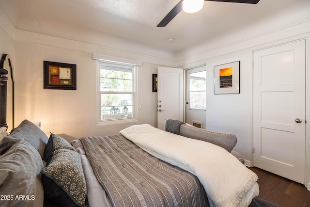 546 W Cambridge Ave, Phoenix, AZ 85003 - bedroom with multiple windows, dark wood-style floors, and a ceiling fan