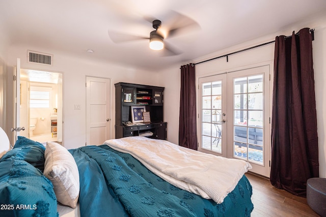 546 W Cambridge Ave, Phoenix, AZ 85003 - bedroom featuring french doors, access to outside, wood finished floors, a ceiling fan, and ensuite bath