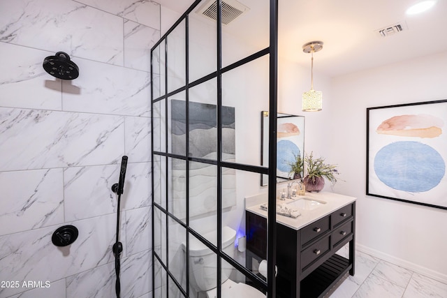546 W Cambridge Ave, Phoenix, AZ 85003 - full bathroom featuring vanity, a tile shower, marble finish flooring, and toilet