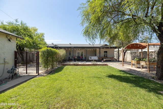 546 W Cambridge Ave, Phoenix, AZ 85003 - back of property with a patio area, a gate, and a vegetable garden