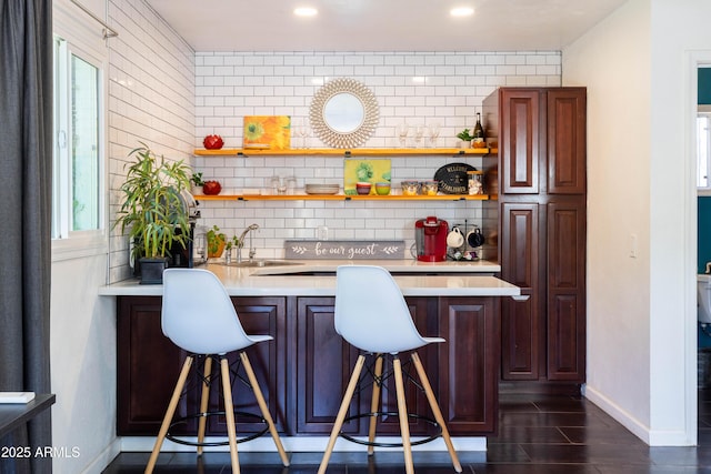 546 W Cambridge Ave, Phoenix, AZ 85003 - bar with tasteful backsplash, baseboards, a sink, and recessed lighting