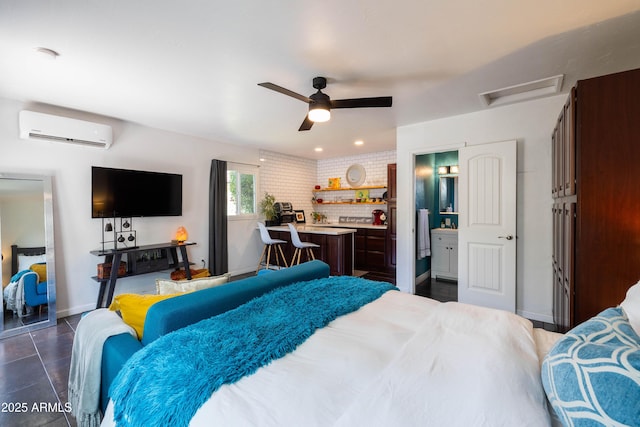 546 W Cambridge Ave, Phoenix, AZ 85003 - bedroom featuring an AC wall unit, attic access, baseboards, a ceiling fan, and ensuite bathroom