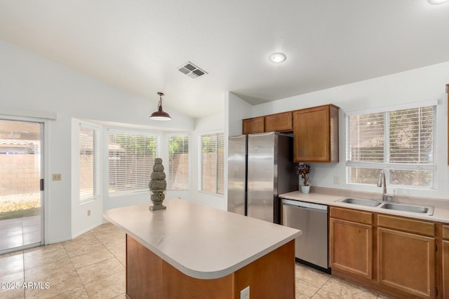 626 W Catclaw St, Gilbert, AZ 85233 - kitchen with visible vents, light countertops, a sink, appliances with stainless steel finishes, and vaulted ceiling