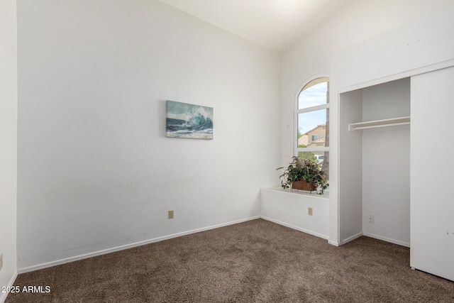 626 W Catclaw St, Gilbert, AZ 85233 - unfurnished bedroom with baseboards, carpet flooring, vaulted ceiling, and a closet