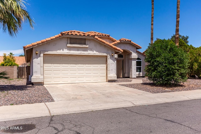 626 W Catclaw St, Gilbert, AZ 85233 - mediterranean / spanish-style house with an attached garage, stucco siding, a tiled roof, and concrete driveway