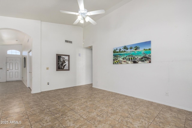 626 W Catclaw St, Gilbert, AZ 85233 - spare room featuring arched walkways, ceiling fan, visible vents, and high vaulted ceiling