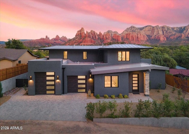 view of front facade with a mountain view and a garage