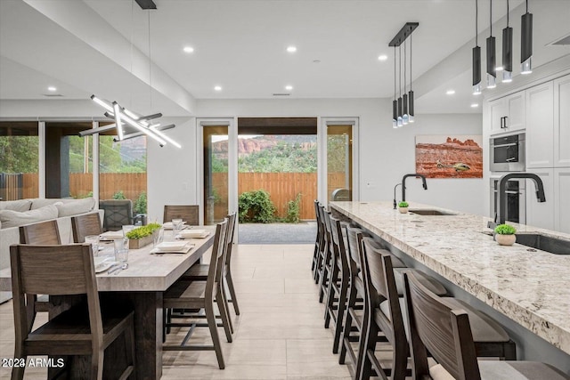 tiled dining room with sink