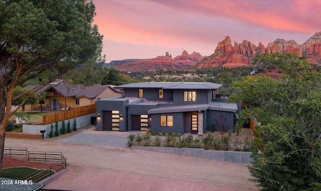 contemporary home featuring a mountain view and a garage