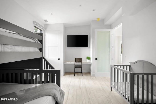 bedroom with light wood-type flooring