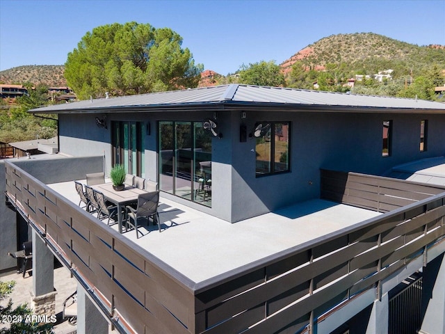 back of house with a mountain view