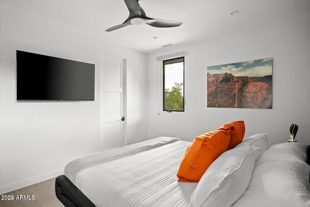 bedroom featuring ceiling fan and hardwood / wood-style floors