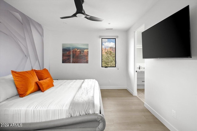 bedroom with ceiling fan and light wood-type flooring