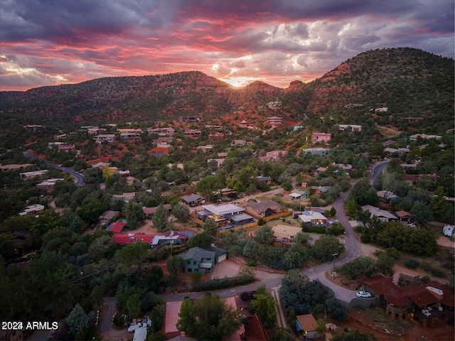 aerial view at dusk with a mountain view