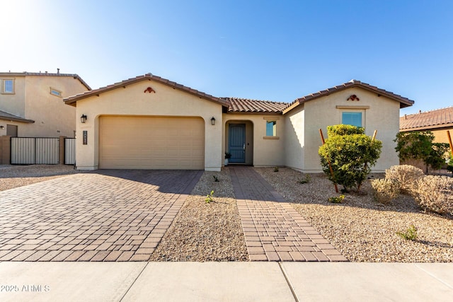 mediterranean / spanish-style home featuring a garage