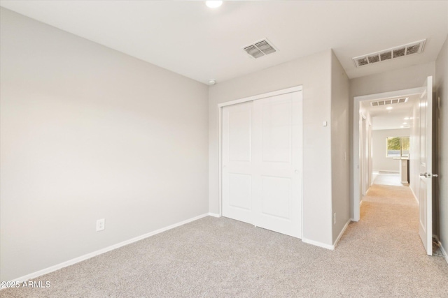 431 W Guinea Ct, Casa Grande, AZ 85122 - unfurnished bedroom with visible vents, light carpet, and baseboards
