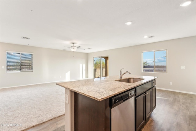431 W Guinea Ct, Casa Grande, AZ 85122 - kitchen featuring dark brown cabinetry, dishwasher, an island with sink, open floor plan, and a sink