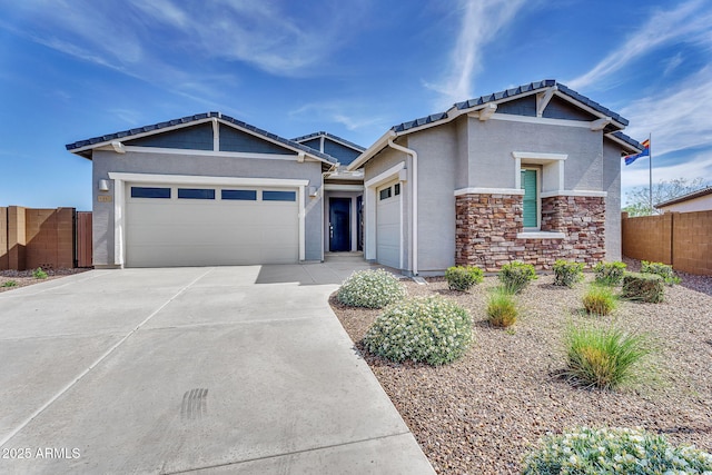 3347 E Malibu Dr, San Tan Valley, AZ 85143 - craftsman-style home with an attached garage, concrete driveway, a tile roof, fence, and stucco siding
