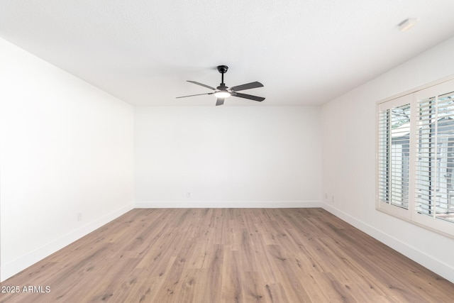 4310 E Sacaton St, Phoenix, AZ 85044 - spare room featuring baseboards, ceiling fan, and light wood finished floors