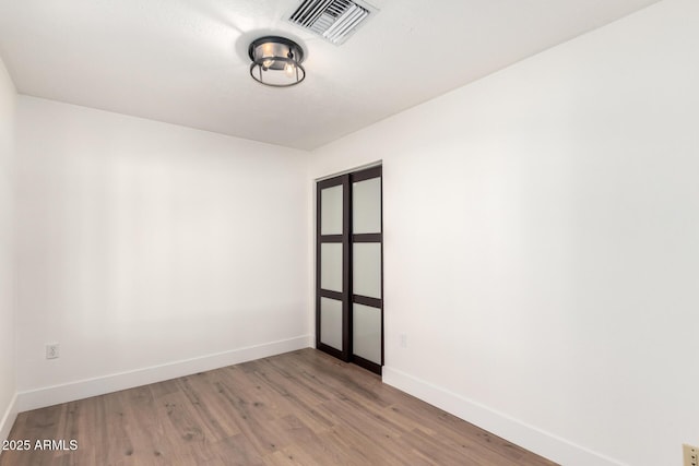 4310 E Sacaton St, Phoenix, AZ 85044 - unfurnished room with baseboards, visible vents, and light wood finished floors