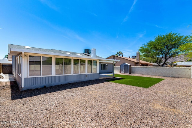 4310 E Sacaton St, Phoenix, AZ 85044 - rear view of property with a patio, a storage shed, a sunroom, a fenced backyard, and an outdoor structure