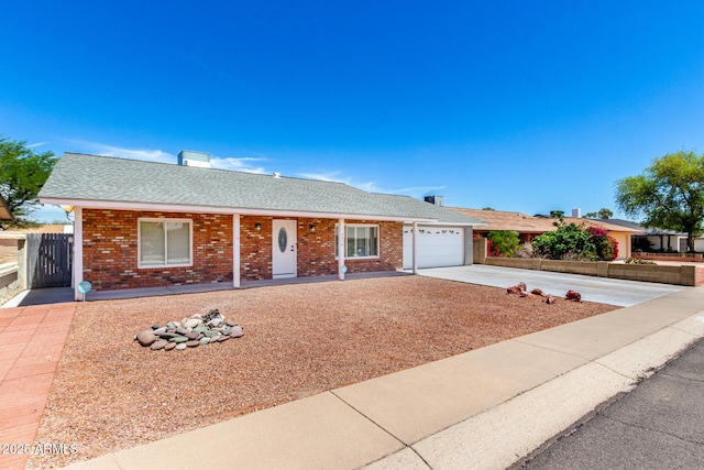 4310 E Sacaton St, Phoenix, AZ 85044 - single story home with a garage, brick siding, a shingled roof, a porch, and driveway