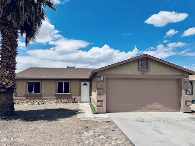 single story home featuring stucco siding, an attached garage, driveway, and a shingled roof