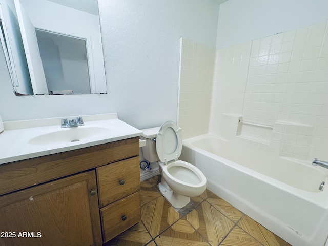 bathroom with toilet, vanity, baseboards, and tub / shower combination