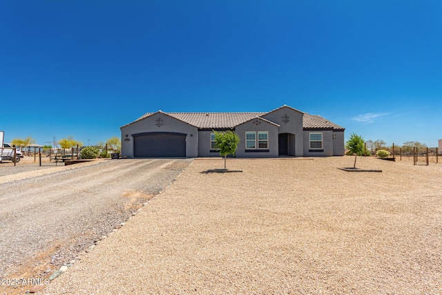 32431 N 226th Ave, Wittmann, AZ 85361 - view of front of home featuring stucco siding, a garage, driveway, and a tile roof