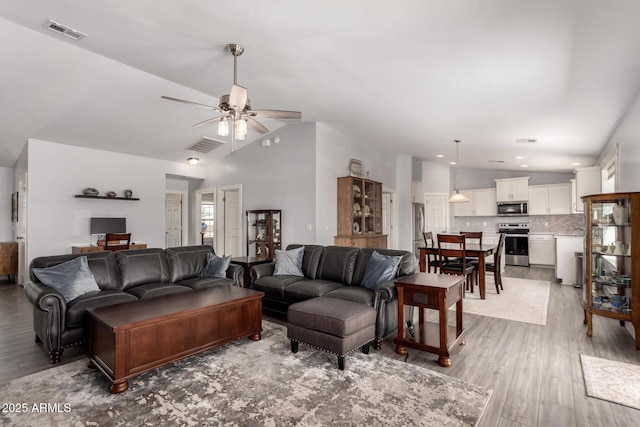 32431 N 226th Ave, Wittmann, AZ 85361 - living room with ceiling fan, light wood-style floors, and vaulted ceiling