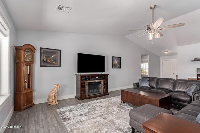 32431 N 226th Ave, Wittmann, AZ 85361 - living area featuring ceiling fan, wood finished floors, vaulted ceiling, and baseboards