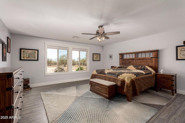 32431 N 226th Ave, Wittmann, AZ 85361 - bedroom with wood finished floors, baseboards, and ceiling fan