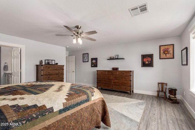 32431 N 226th Ave, Wittmann, AZ 85361 - bedroom with wood finished floors, baseboards, and ceiling fan