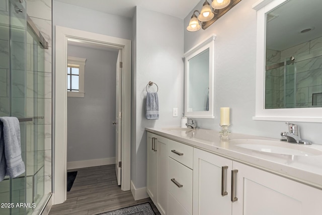 32431 N 226th Ave, Wittmann, AZ 85361 - full bath with a stall shower, double vanity, wood finished floors, and baseboards
