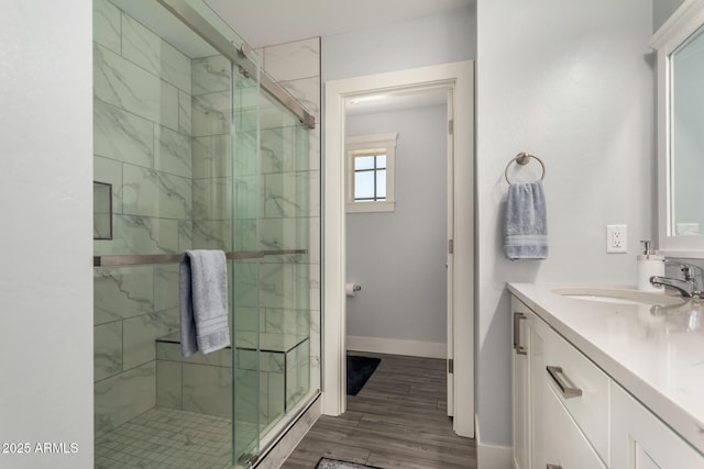 32431 N 226th Ave, Wittmann, AZ 85361 - full bath featuring a stall shower, vanity, wood finished floors, and baseboards