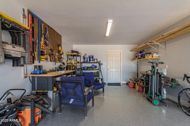 32431 N 226th Ave, Wittmann, AZ 85361 - garage featuring a workshop area and baseboards