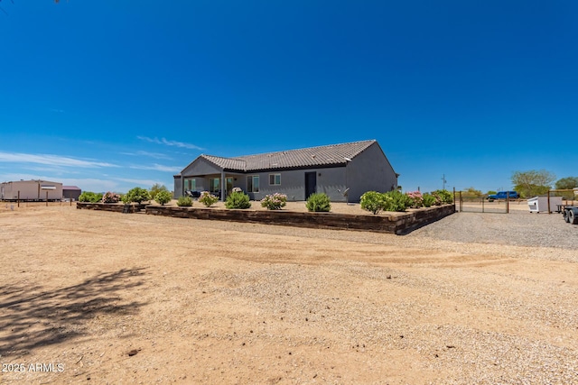 32431 N 226th Ave, Wittmann, AZ 85361 - back of house featuring a tile roof and stucco siding
