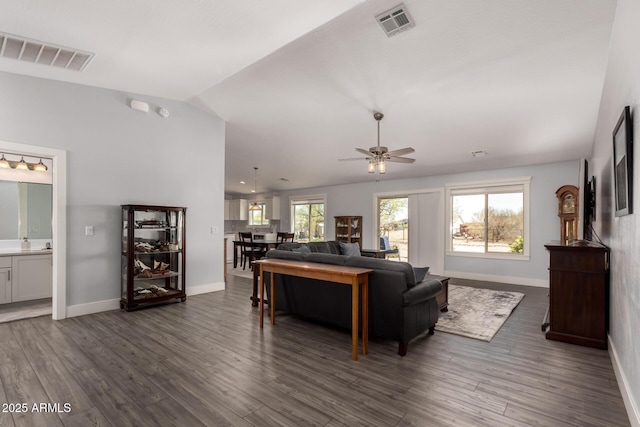 32431 N 226th Ave, Wittmann, AZ 85361 - living area featuring a ceiling fan, dark wood-type flooring, vaulted ceiling, and baseboards
