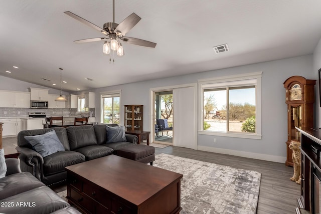32431 N 226th Ave, Wittmann, AZ 85361 - living area with lofted ceiling, wood finished floors, a ceiling fan, baseboards, and recessed lighting