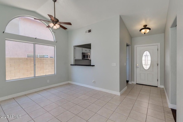 4330 E Desert Trumpet Rd, Phoenix, AZ 85044 - entryway featuring a ceiling fan, lofted ceiling, light tile patterned floors, and baseboards