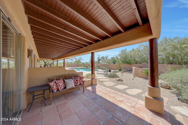 view of patio / terrace with a fenced in pool