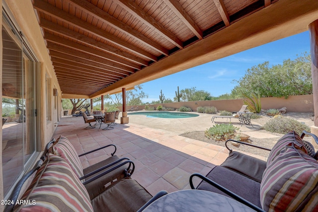 view of patio / terrace with a fenced in pool